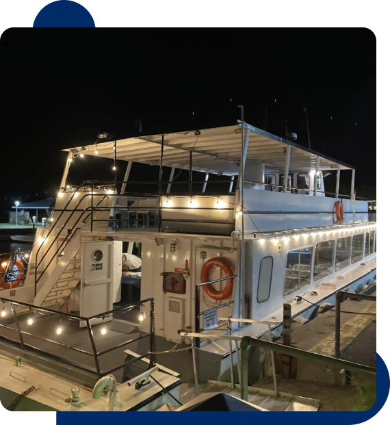 Friends enjoying a group outing on the deck of a cruise vessel departing from Midland.