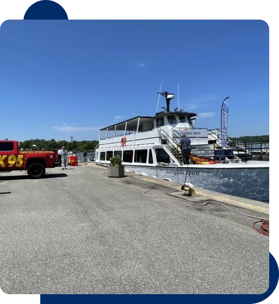 Visitors gathering on deck while admiring the surrounding island scenery.