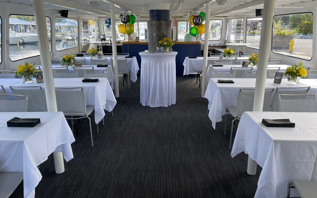 Guests celebrating together during private party cruises while sailing across the scenic waters of Georgian Bay.