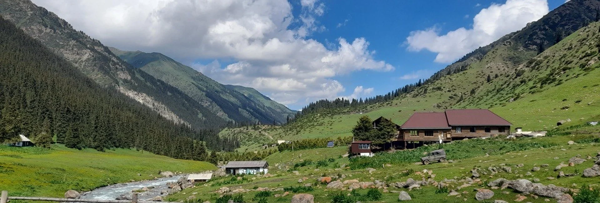 Travelers exploring mountains through Kyrgyzstan tour packages