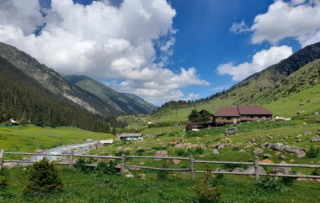 Travelers exploring mountains through Kyrgyzstan tour packages