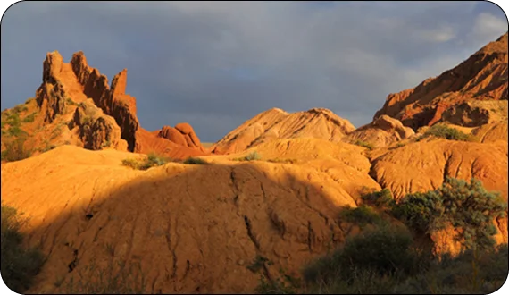 Visitors resting at a viewpoint during summer tours in Kyrgyzstan