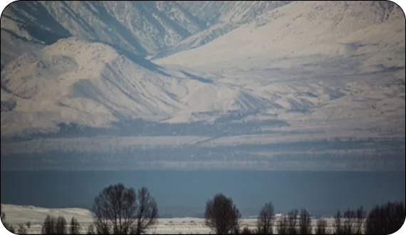 Skiers exploring backcountry terrain on winter tours in Kyrgyzstan
