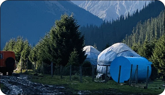 Travelers preparing for ski tours with guides in Kyrgyzstan
