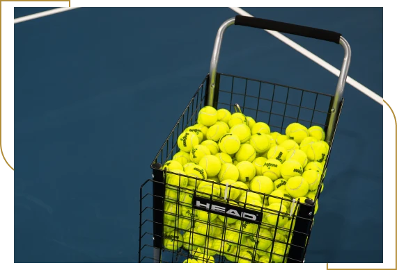 A coach guiding members during racquet sports classes during a training session in Burlington.
