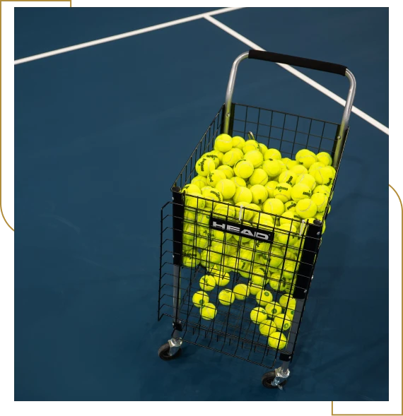 A coach guiding members during racquet sports classes during a training session in Burlington.
