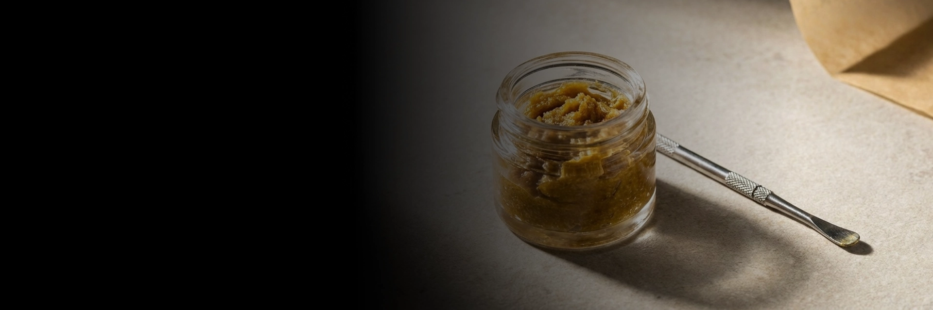 Customer exploring THC wax in Kansas City inside a display case