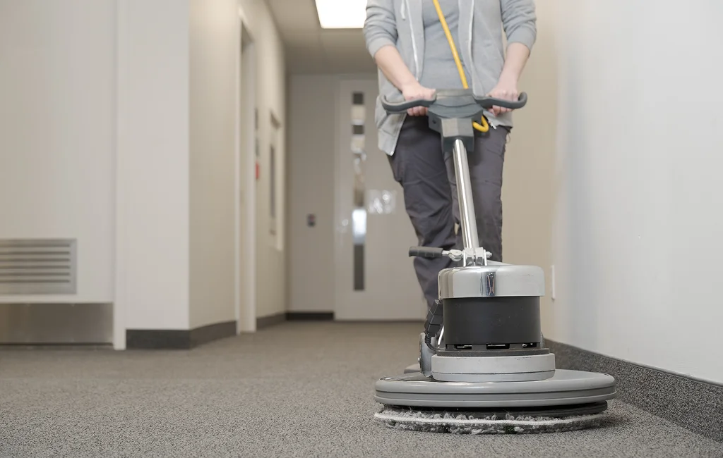 Cleaning team addressing common service questions in a workspace setting