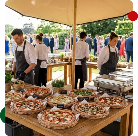 A group celebrating with catering food spread across a long table in Lakeland.