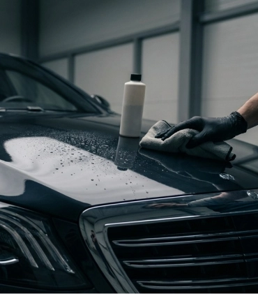 Team inspecting paint at detail shop in Langley, BC