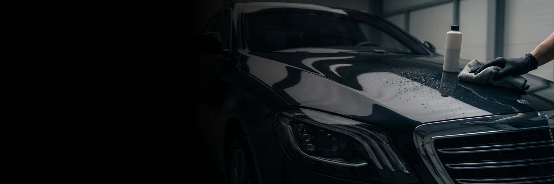 Technician applying ceramic coating services on car in Langley, BC