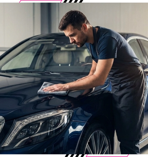 Technician sealing auto PPF installation on edges in Langley, BC