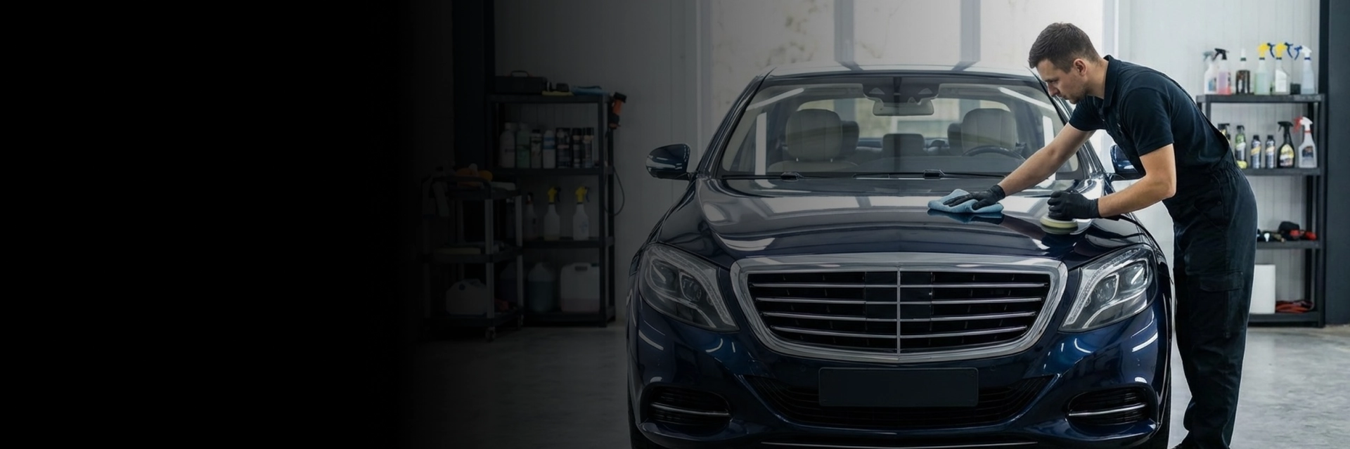 Technician performing auto detailing on vehicle exterior in Langley, BC