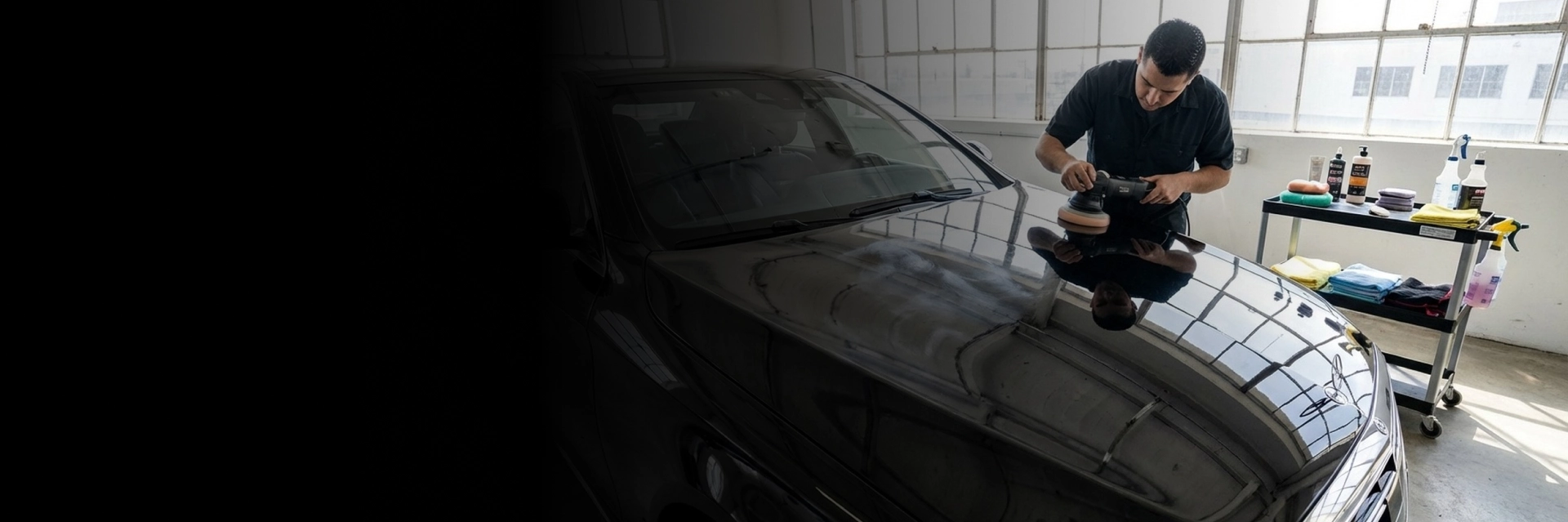 Technician performing car paint correction on hood in Langley, BC