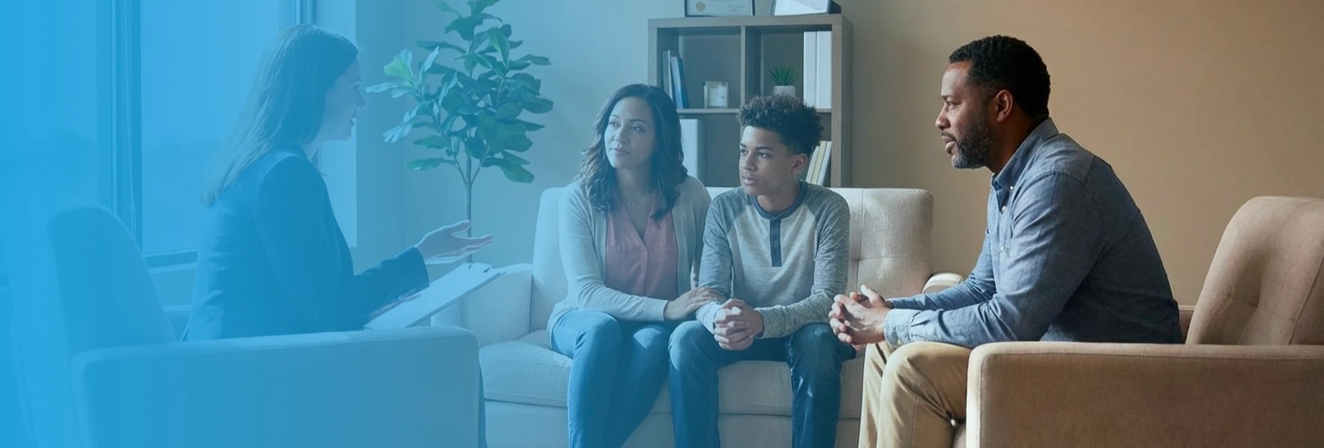 Therapist discussing family-centered mental health program with parents across Virginia