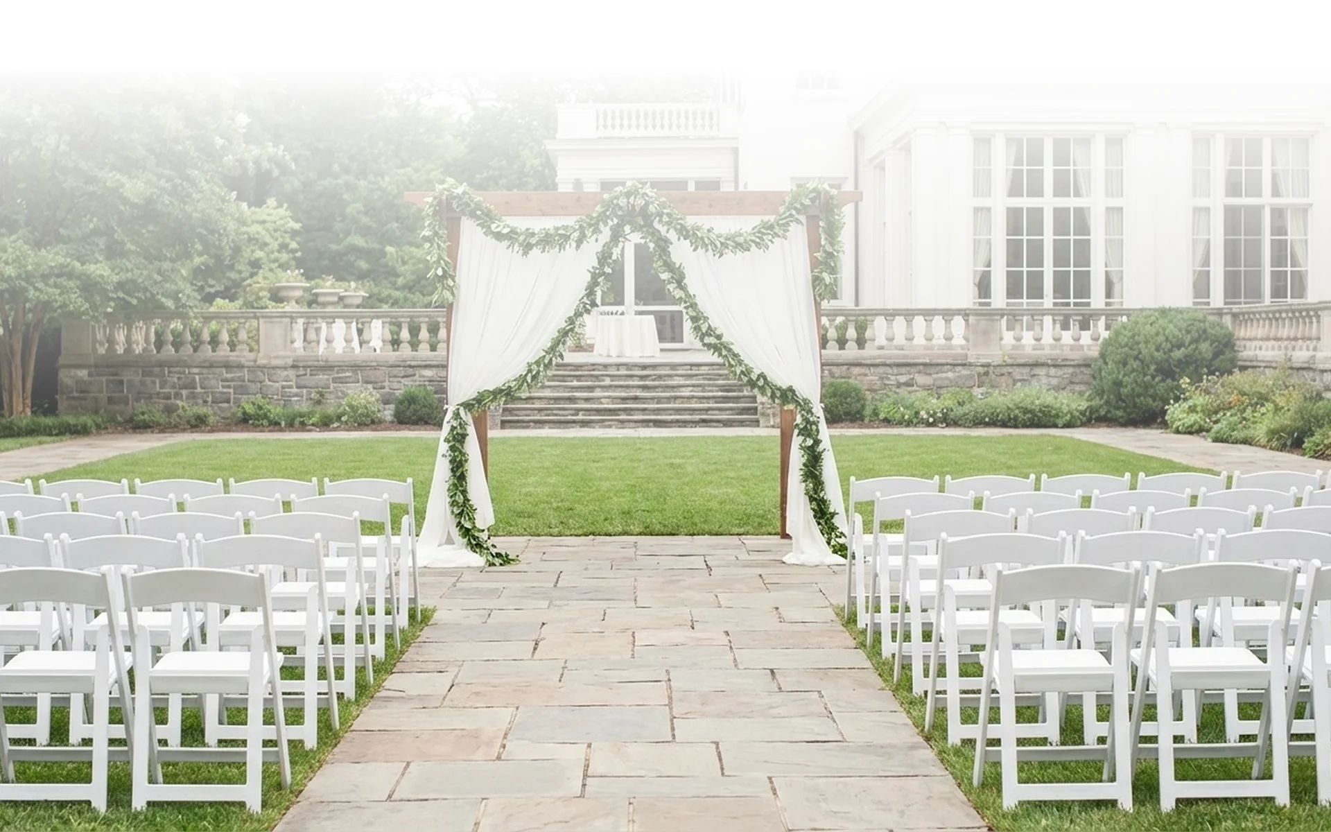 An elegant event venue in Aurora, CO prepared for a wedding ceremony with floral décor.