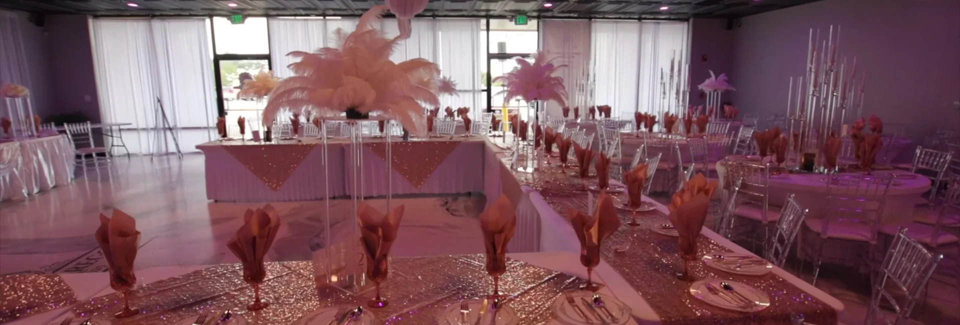 A beautifully arranged event space services setup in Aurora, CO with elegant décor and lighting.