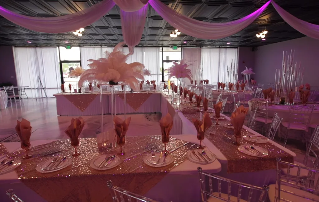 A beautifully arranged event space services setup in Aurora, CO with elegant décor and lighting.
