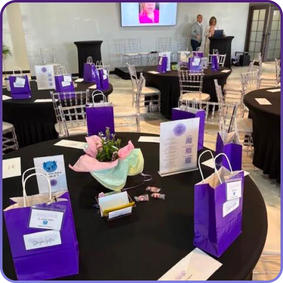 Event planners coordinating corporate event planning in Aurora, CO with digital schedules.