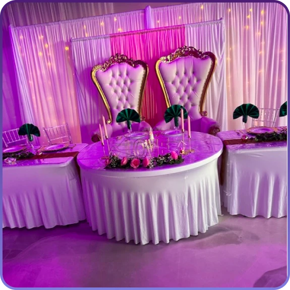 A fully styled event space created through event design services in Aurora, CO with ambient lighting.