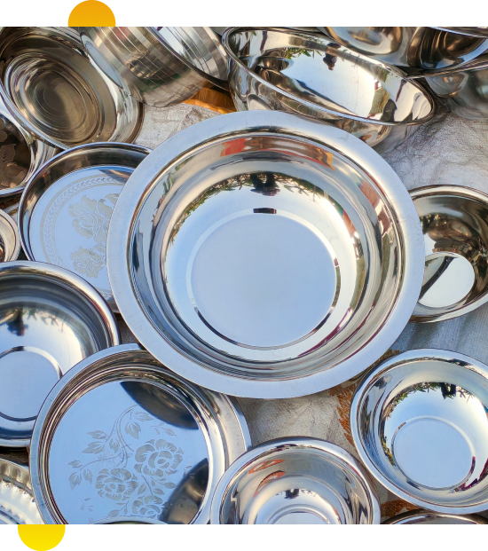 Couple comparing cookware while shopping a kitchen supplies store in Oshawa, Canada