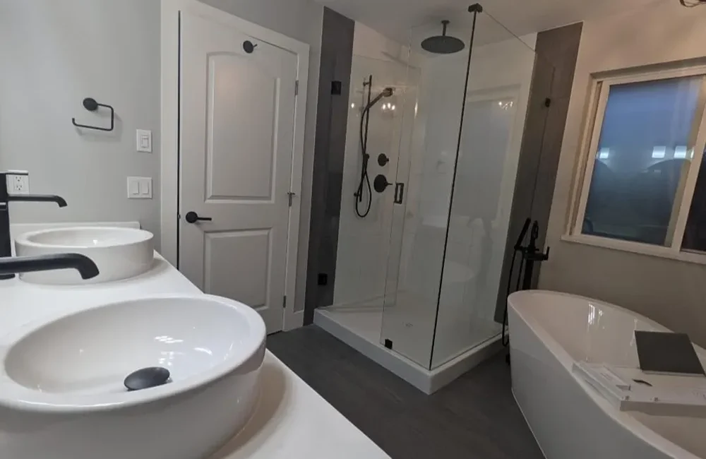 A bathroom transformation using home renovations services in Edmonton with updated fixtures and layout.