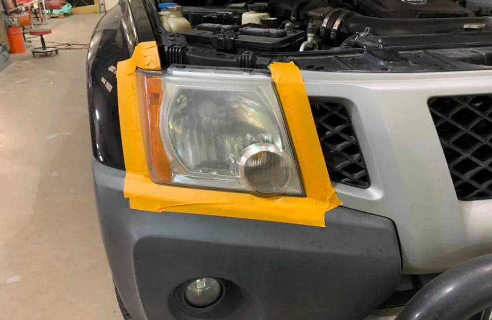 Technician inspecting finished car in Merriam garage