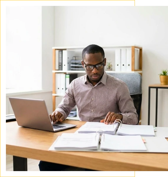 A desk displays financial reports for bookkeeping services in Mechanicsburg
