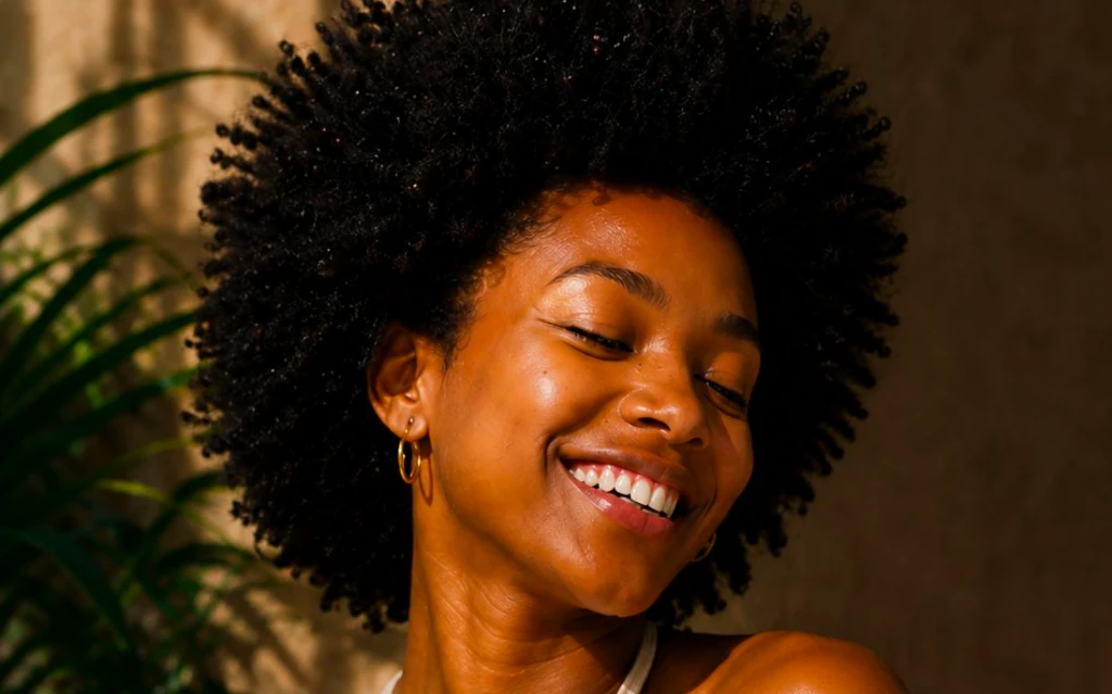 Customer exploring Natural Hair Care Products in a modern retail environment.