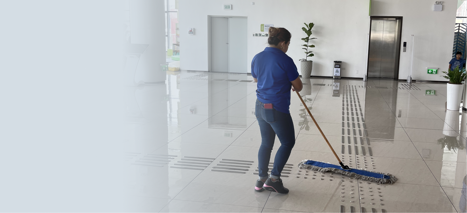 Team providing janitorial services in Atlanta inside a modern office lobby
