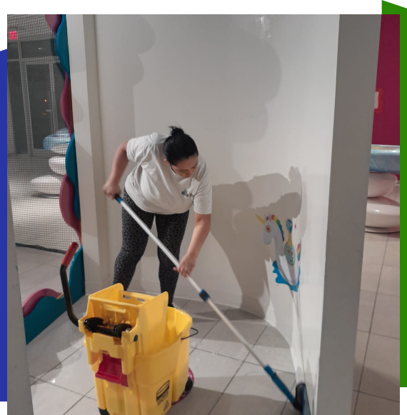 Worker delivering commercial cleaning services in Norcross office