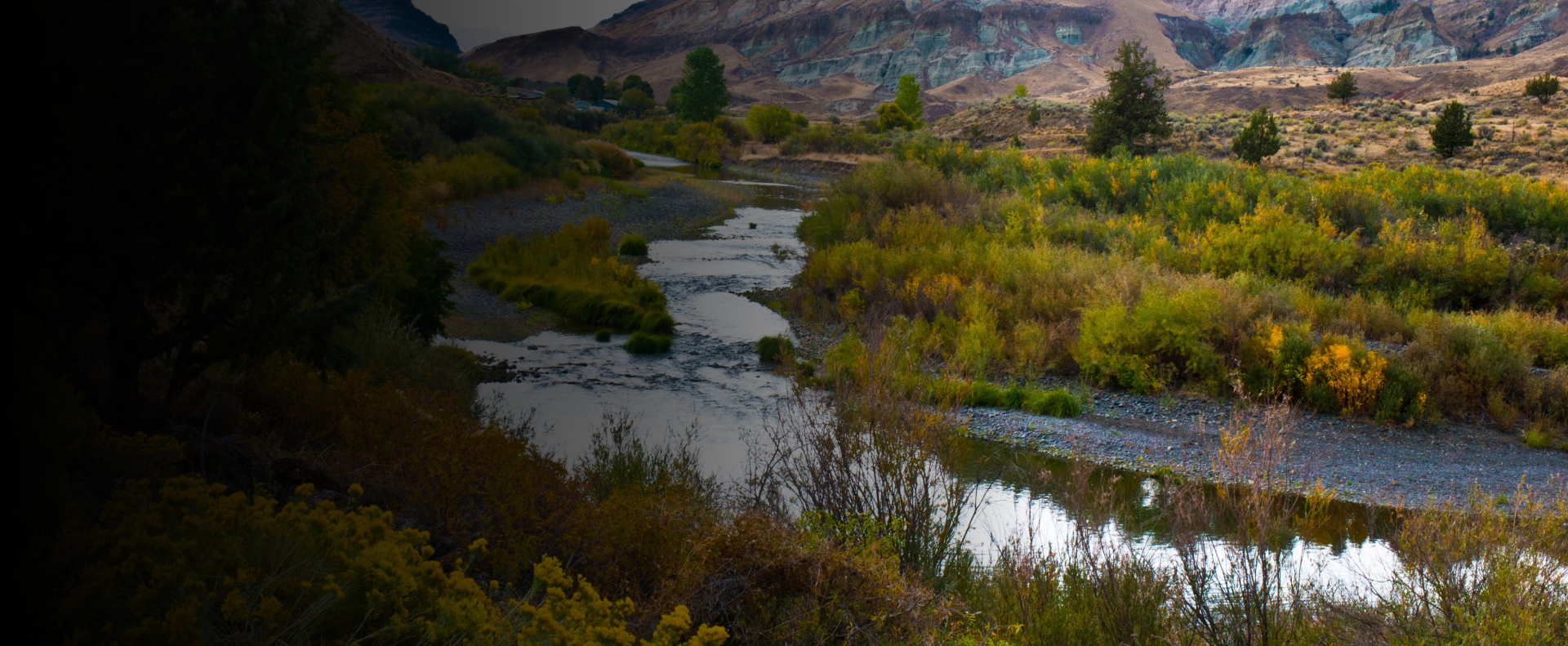 Visitors exploring sightseeing spots in John Day near river