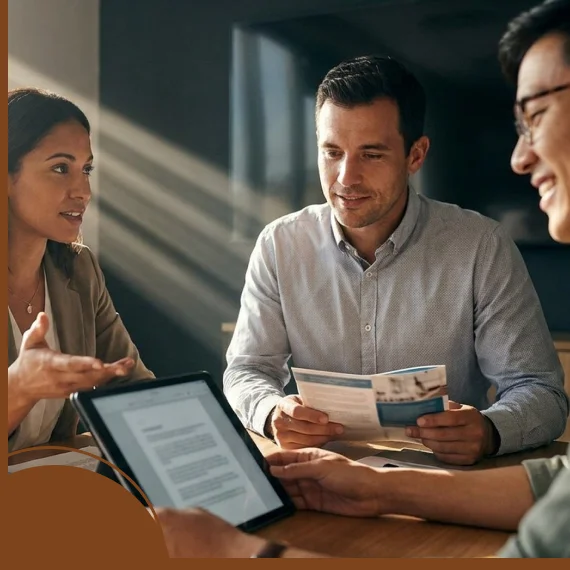 Employees viewing legal plans benefits in educational workplace setting.