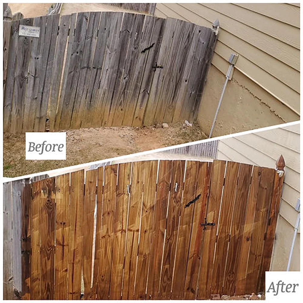 Technician performing pressure washing service in Atlanta on a residential driveway