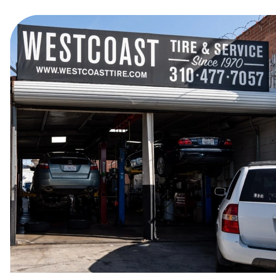 Technician testing voltage during battery replacement in Los Angeles