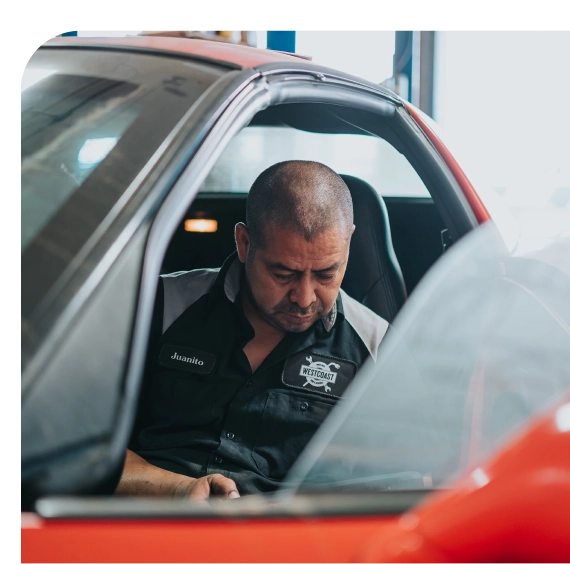Technician testing electrical systems during hybrid repair in Los Angeles