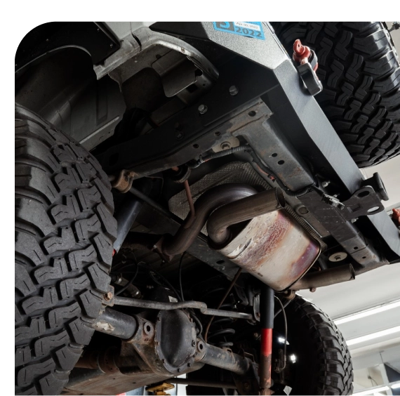 Technician checking control arms during suspension repair in Los Angeles