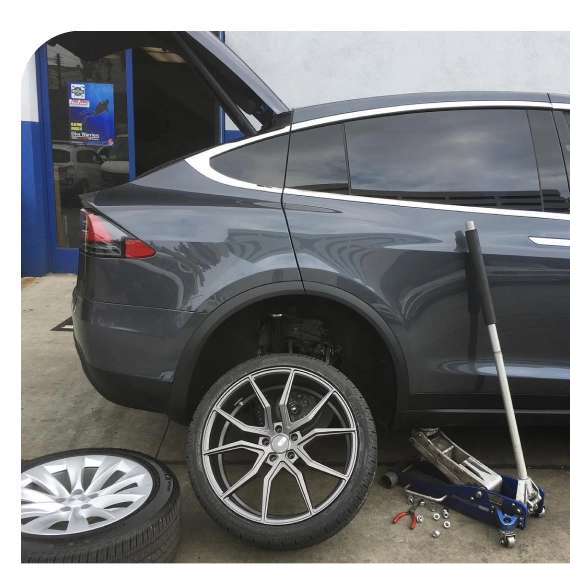 Technician inspecting tread during tire shop in Los Angeles service