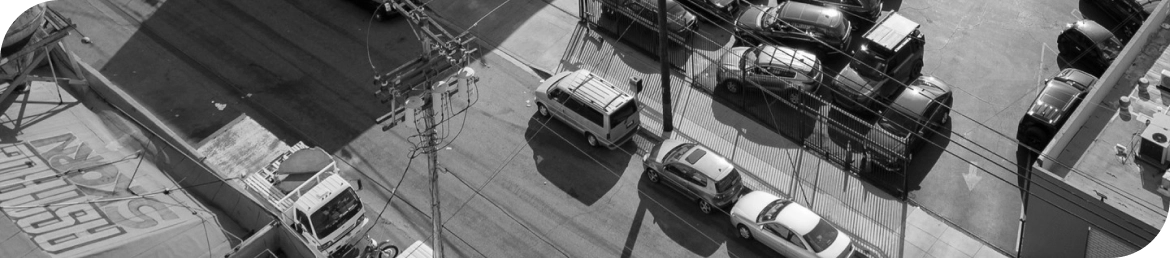 Mobile tire installation van servicing vehicle in Los Angeles parking lot