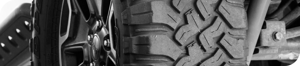 Mobile tire installation van servicing vehicle in Los Angeles parking lot
