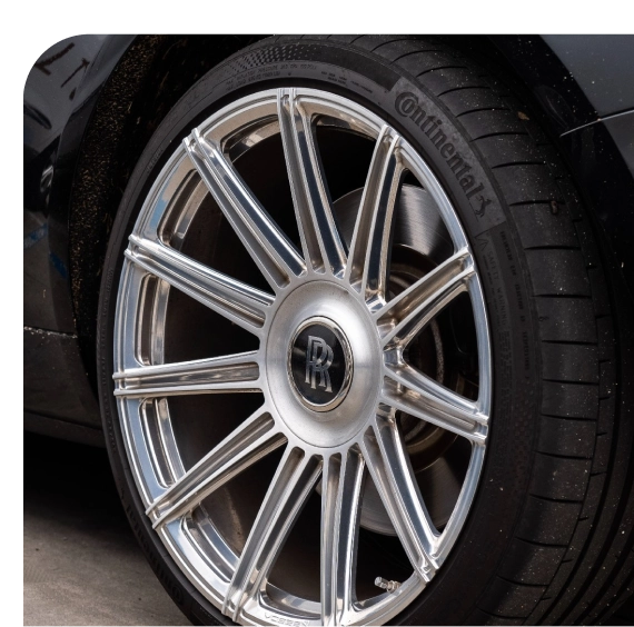 Driver receiving mobile tire services in San Fernando Valley driveway
