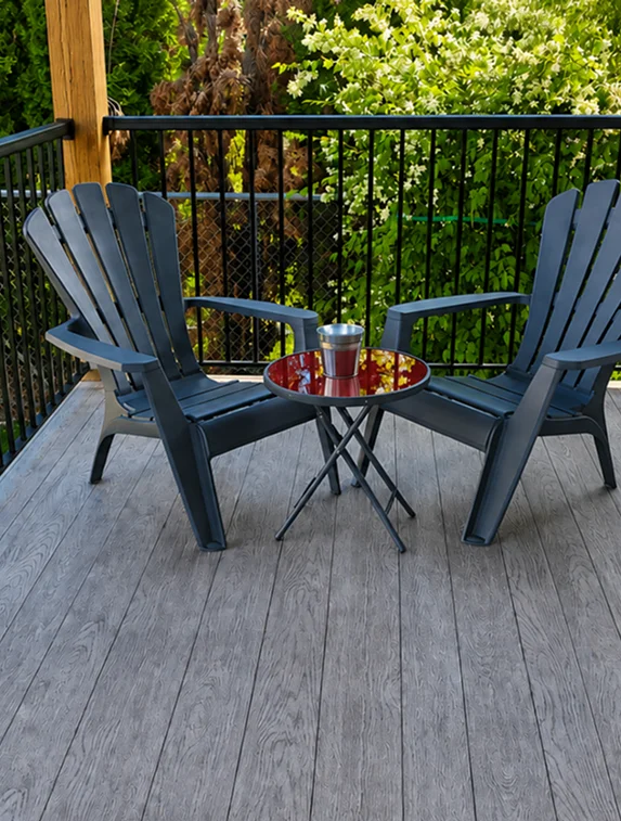 Weatherdek vinyl deck with patio chairs and table on a residential balcony