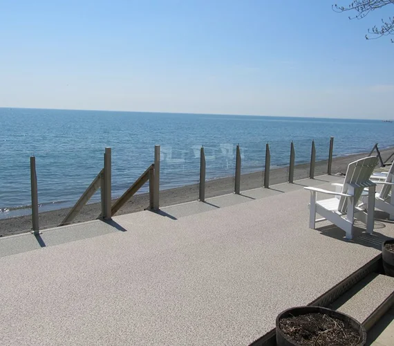 Premium aluminum and glass railing system installed on an elevated outdoor deck
