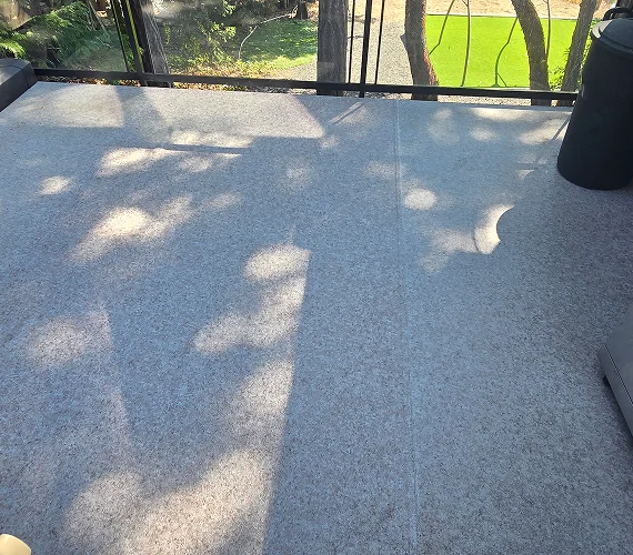 Premium aluminum and glass railing system installed on an elevated outdoor deck