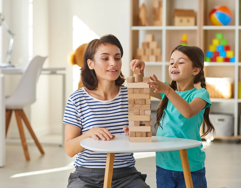 Child practicing social skills during school-based ABA therapy
