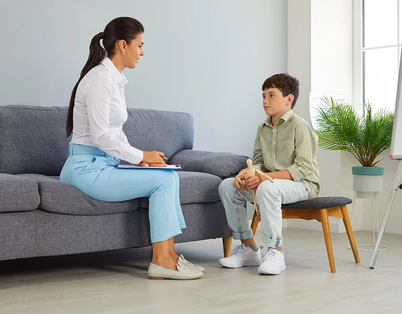 Therapist supporting communication through ABA therapy for children