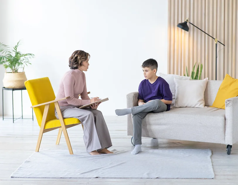 ABA therapist in Sun City helping a child strengthen communication skills