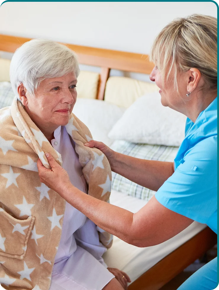 Caregiver reviewing daily assistance package with family