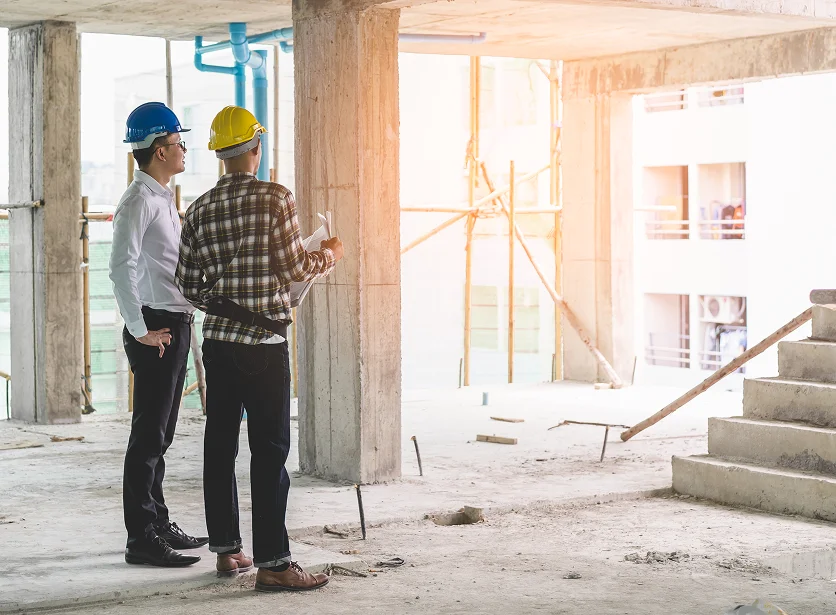 Crew discussing commercial remodeling services in Los Angeles at a job site.