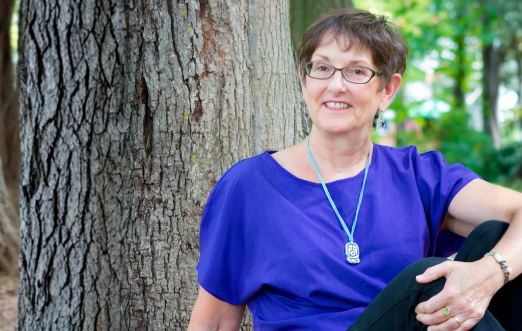 Pamela Van Nest, midlife life coach for women, writing in a notebook